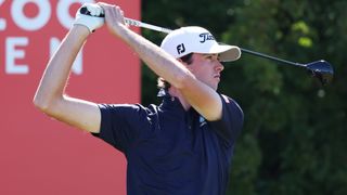 Golfer wearing navy shirt