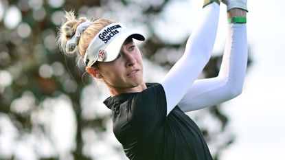 Blonde golfer at driving range