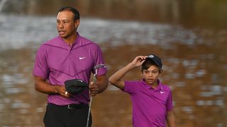 Two people wearing matching purple jerseys