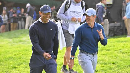 Two golfers walking on course