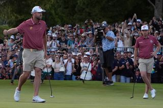 Golfers wearing red on golf course